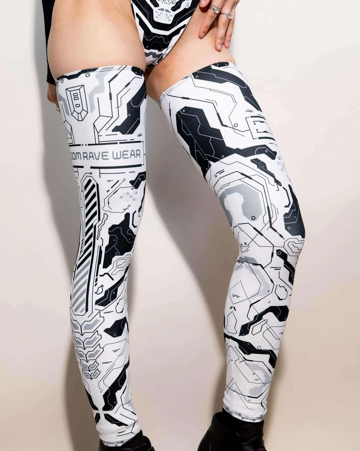Mechanoid leg sleeves in white, designed for rave outfits, featuring a high-tech print and over-the-knee fit.
