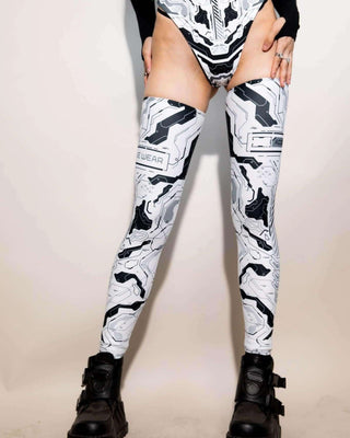 Mechanoid leg sleeves in white worn with black platform boots, perfect for rave outfits and festival style.