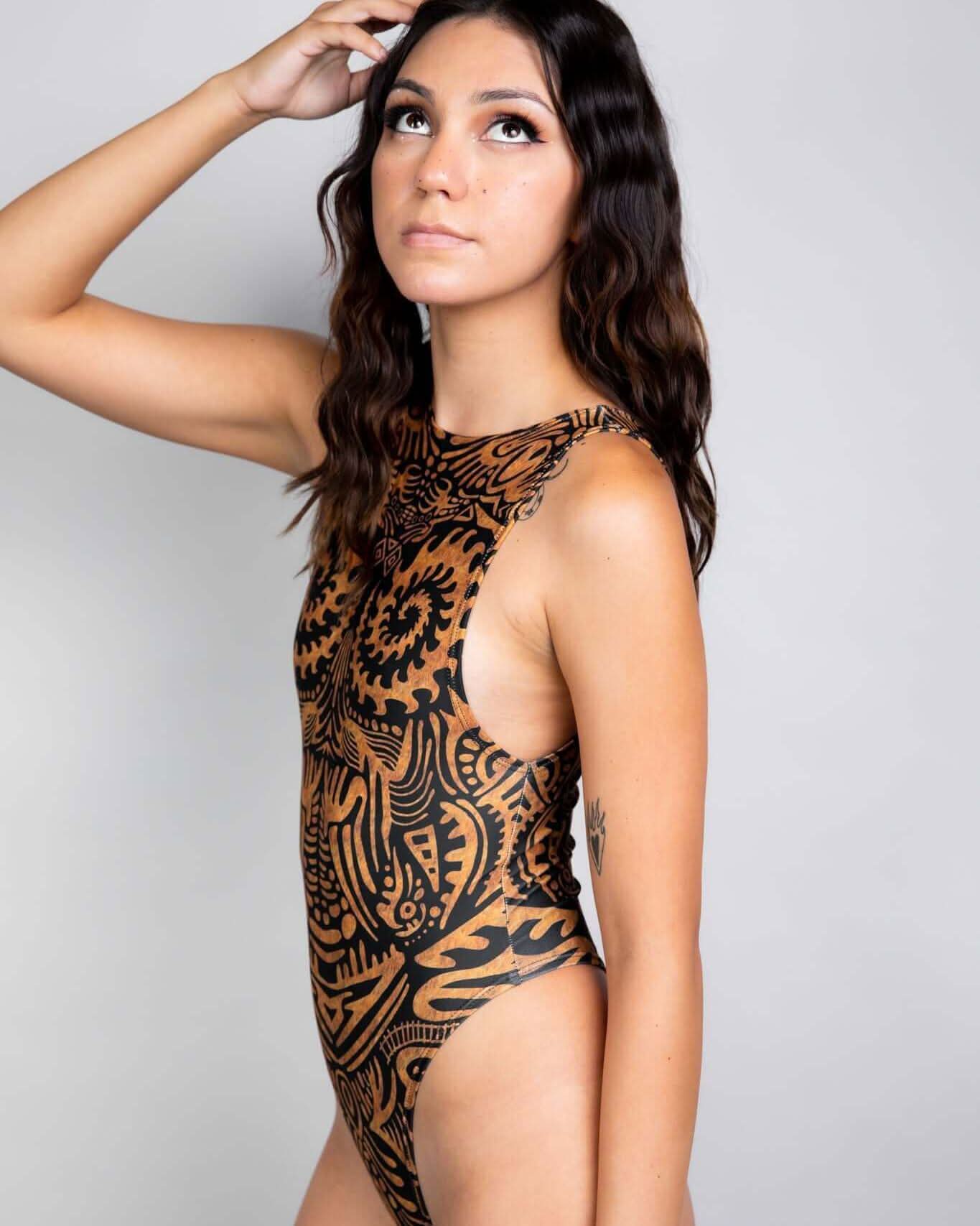 Model showcasing the Primal Sideboob Bodysuit with intricate patterns, perfect for rave outfits and festival vibes.