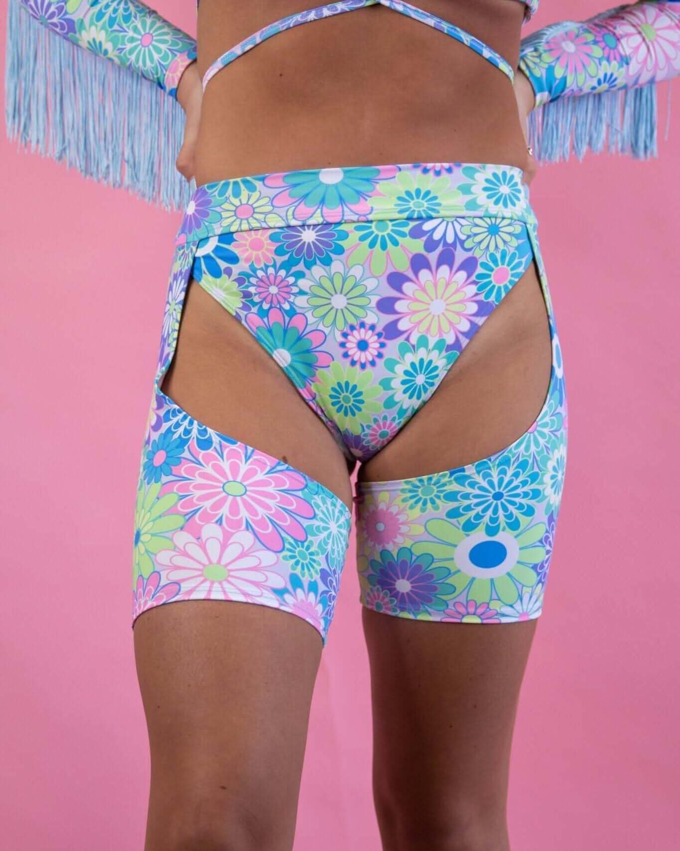 Retro Bloom Chaps with cutout design and pastel flower print, perfect for stylish rave outfits.