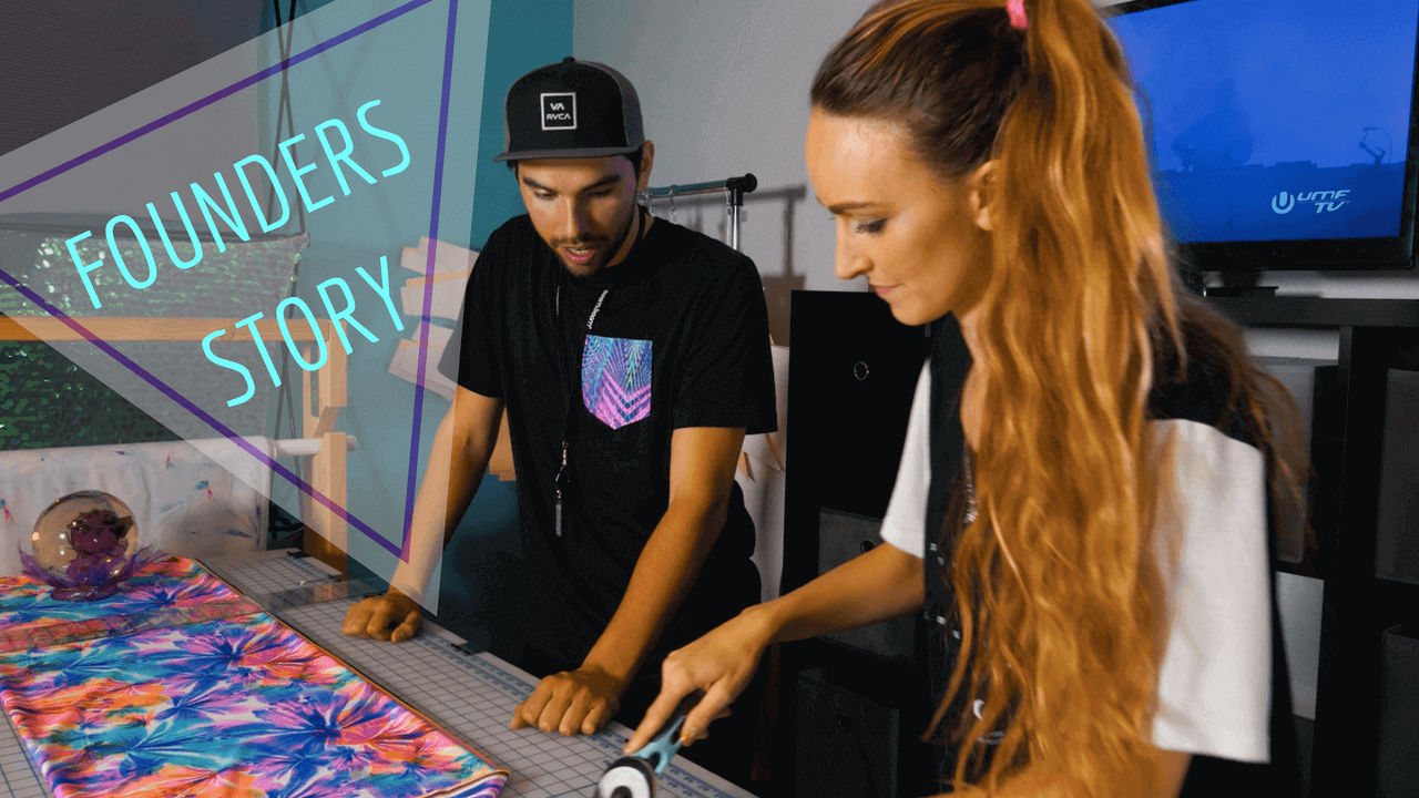 FRW's founders at a cutting table with colorful printed fabric. Archival photograph.