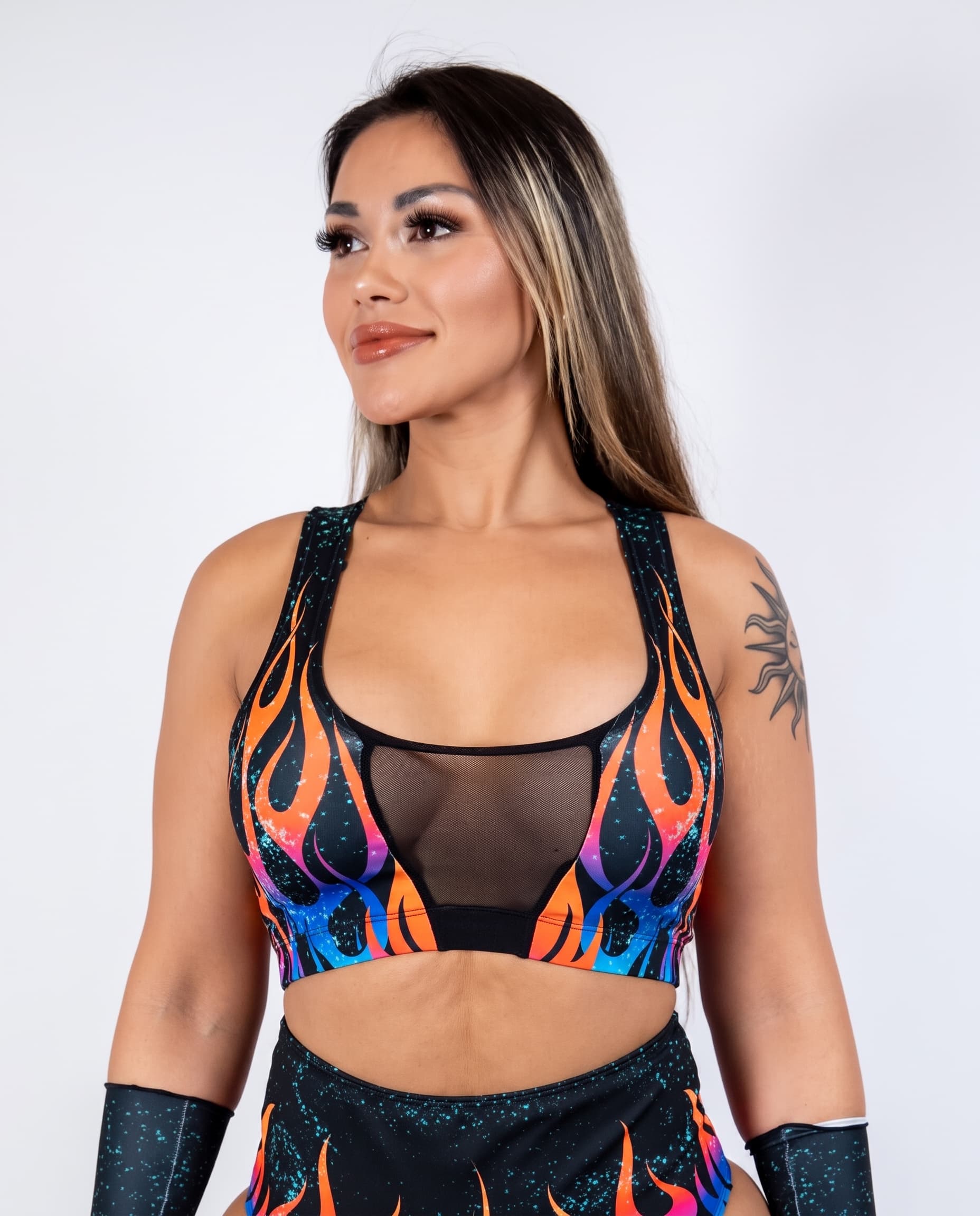 Blaze V-Free Top, front view showing orange and blue flames around a sheer black mesh center panel