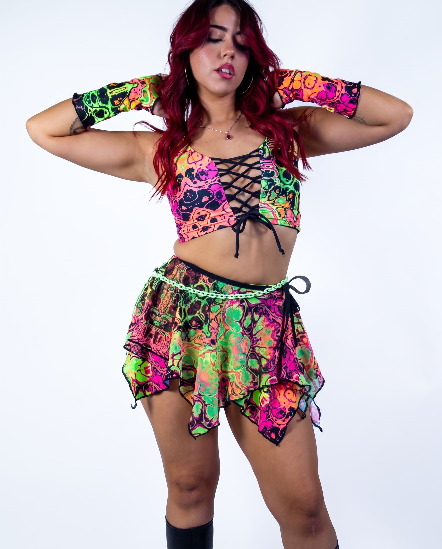 Intensity Fairy Skirt, front view showing neon patterned layers, pointed hem and pale green hip chain