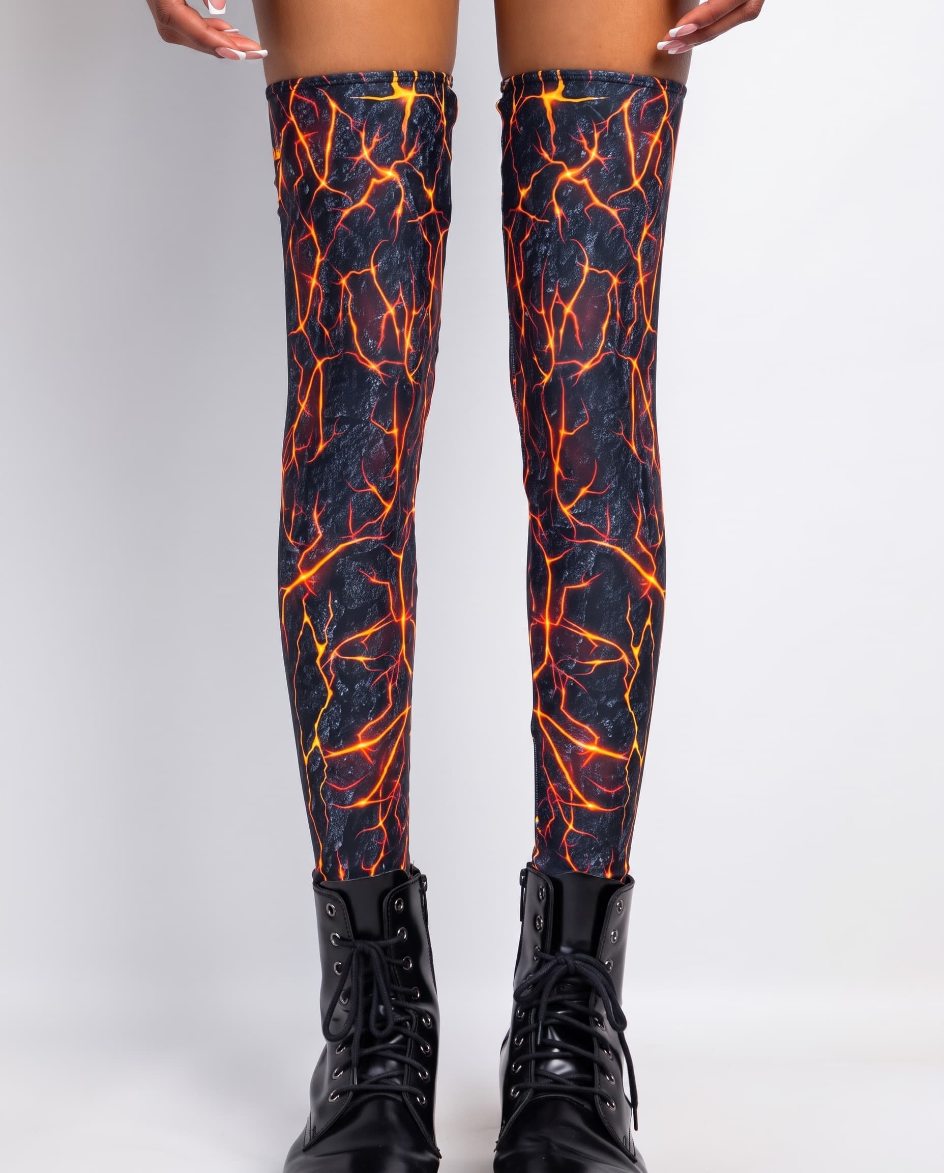 Magma Leg Sleeves, front view showing orange and yellow crack print on black with lace-up boots