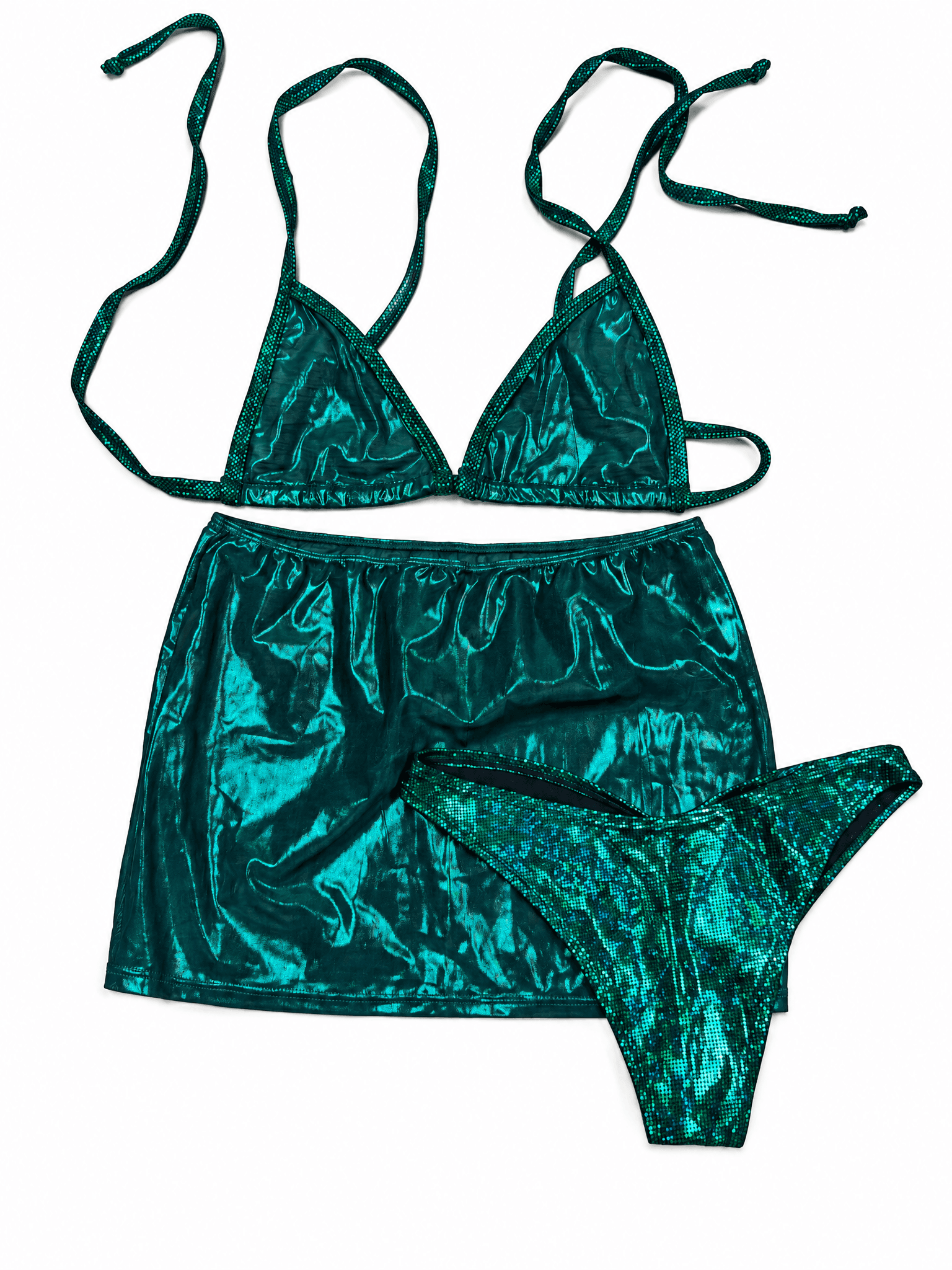 Emerald Green Mesh Set, flat lay of shiny triangle bikini top, mini skirt and dotted green bottoms on white