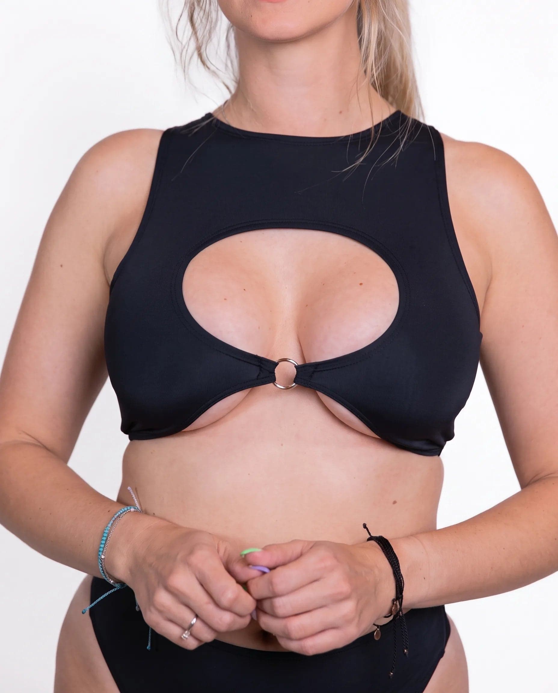 Matte Black Keyhole Top, front view showing oval chest cutout, central metal ring and high neckline