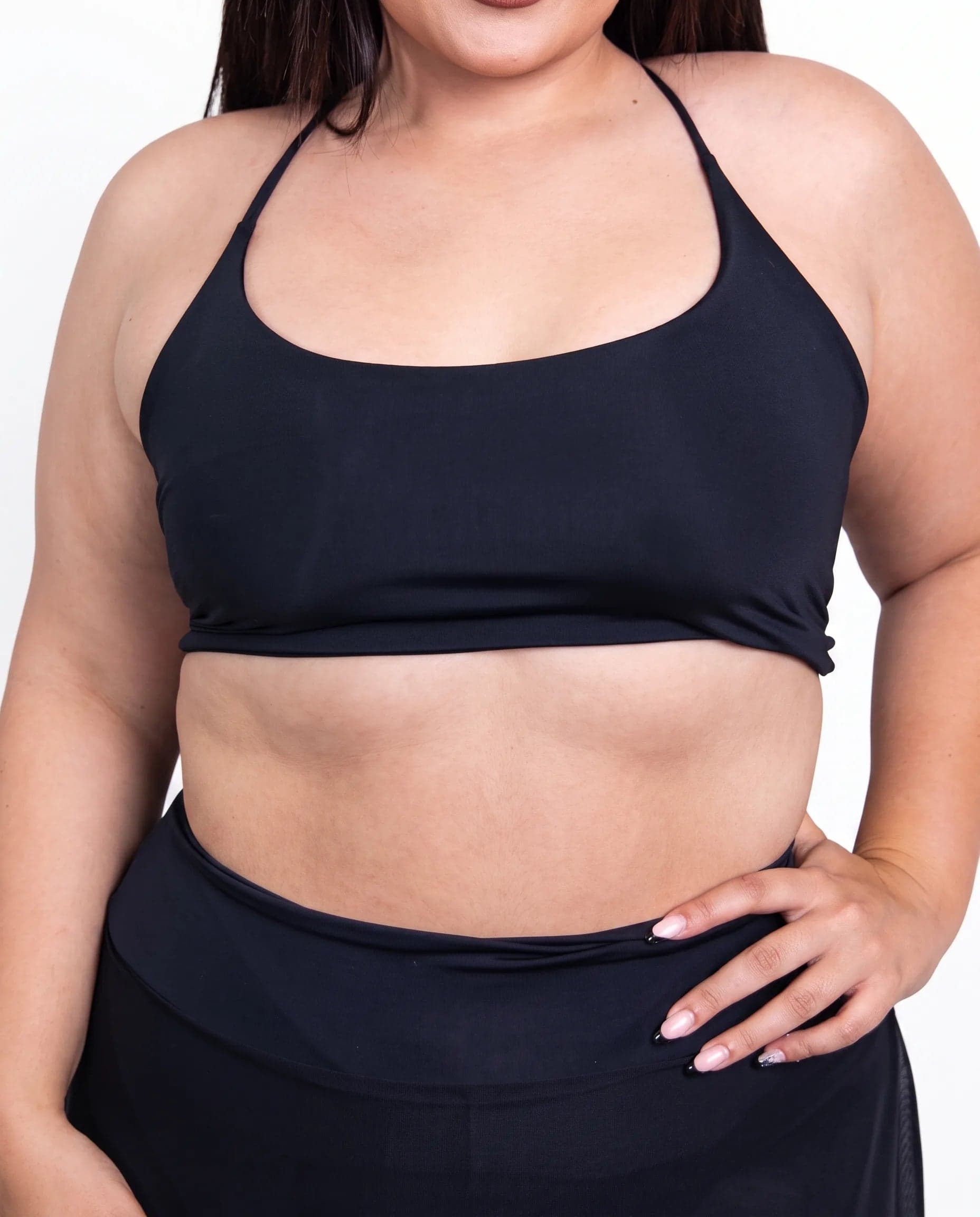 Matte Black Lush Top, front view showing the scoop neckline, thin halter straps and cropped hem