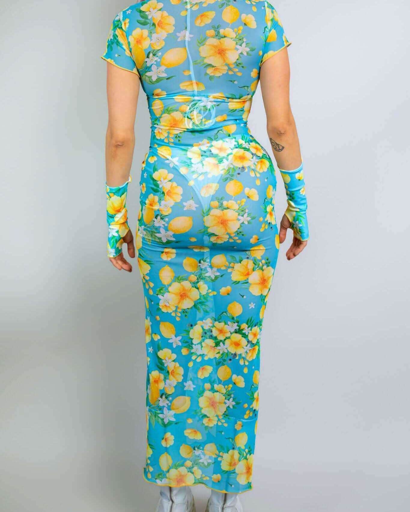 Rave bodysuit style Lemon Drop mesh maxi dress back view with citrus floral print for festival outfit