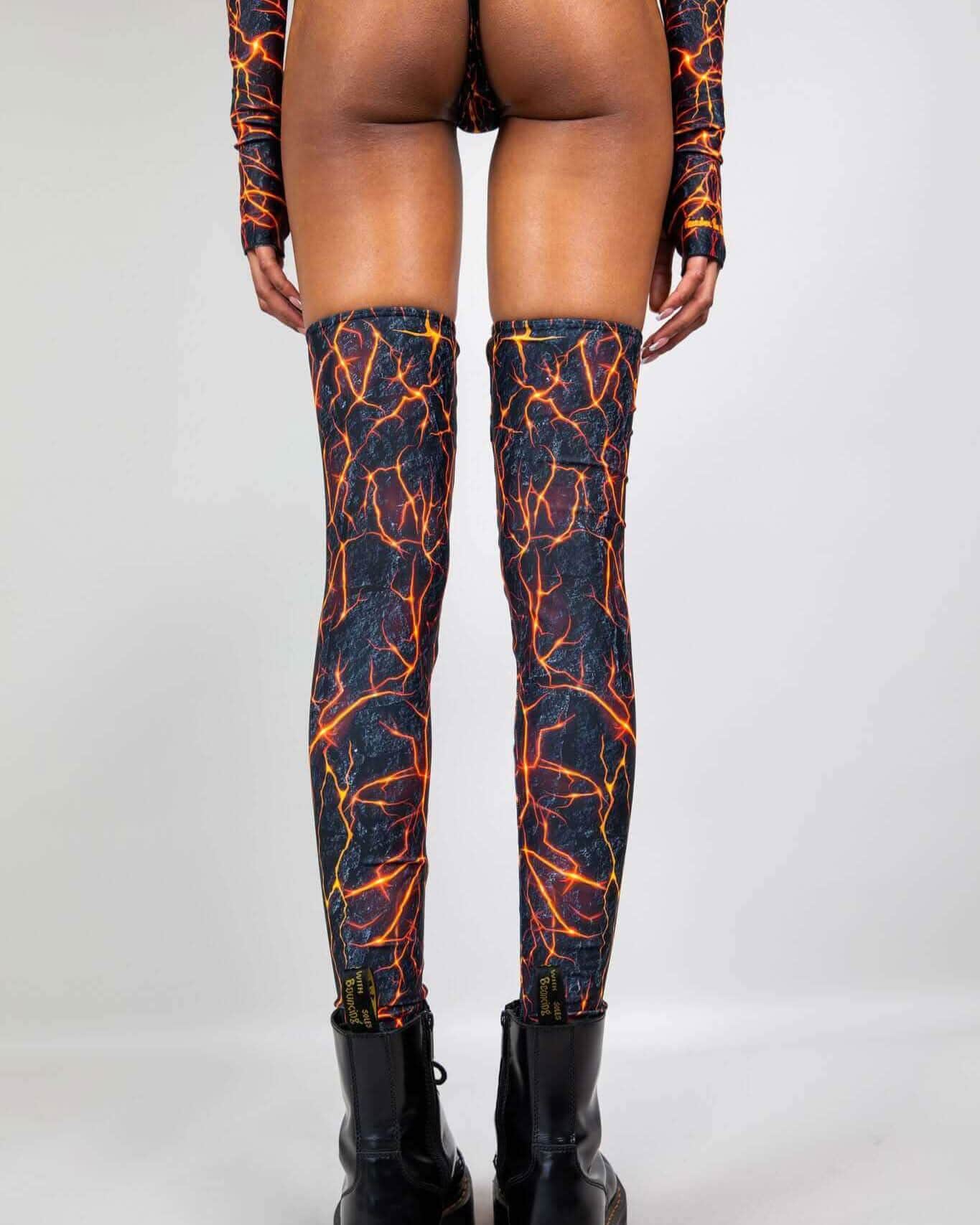 Rave arm sleeves and leg sleeves set in magma flame print, back view festival outfit styling