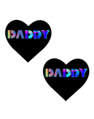 Heart-shaped black nipple cover pasties with holographic 'DADDY' lettering, ideal for rave outfits and bold style.