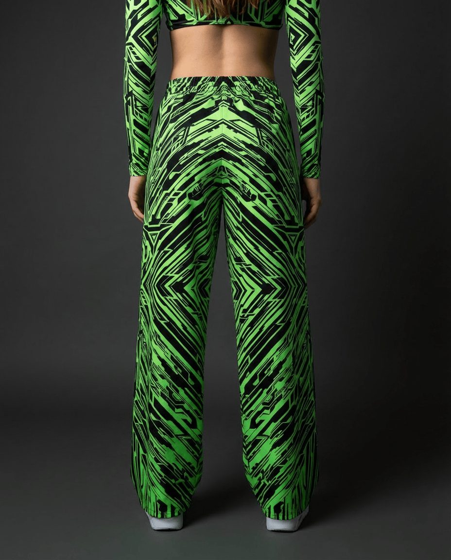 Alt Tag: Techtronix Lucy Pants neon green and black circuitry print wide-leg pants, back view cyber style rave dancewear
