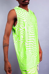 Model in a vibrant green sleeveless hooded top and matching shorts from Freedom Rave Wear, featuring psychedelic patterns. -5