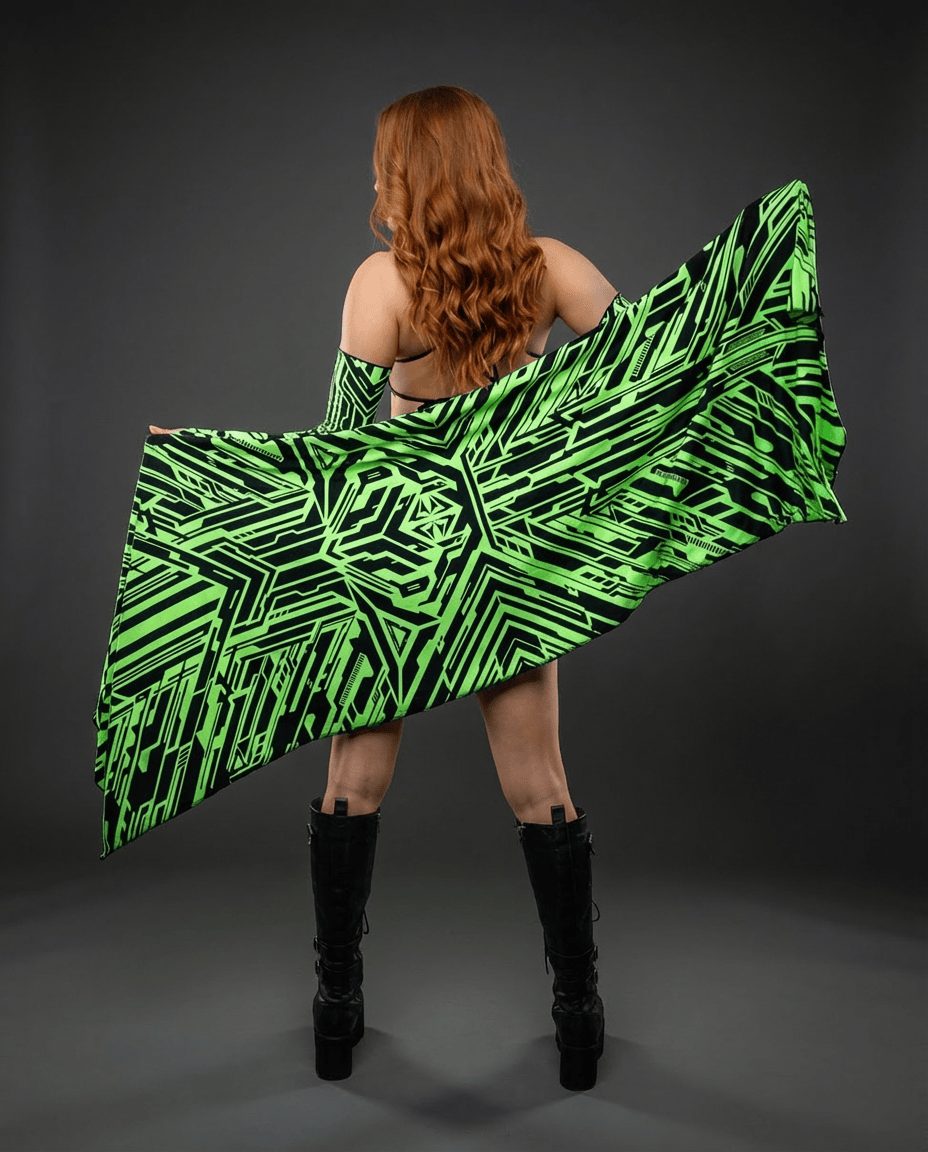Alt Tag: Techtronix Festival Scarf neon green and black circuitry rave scarf worn as a cape, cyber-futuristic festival accessory