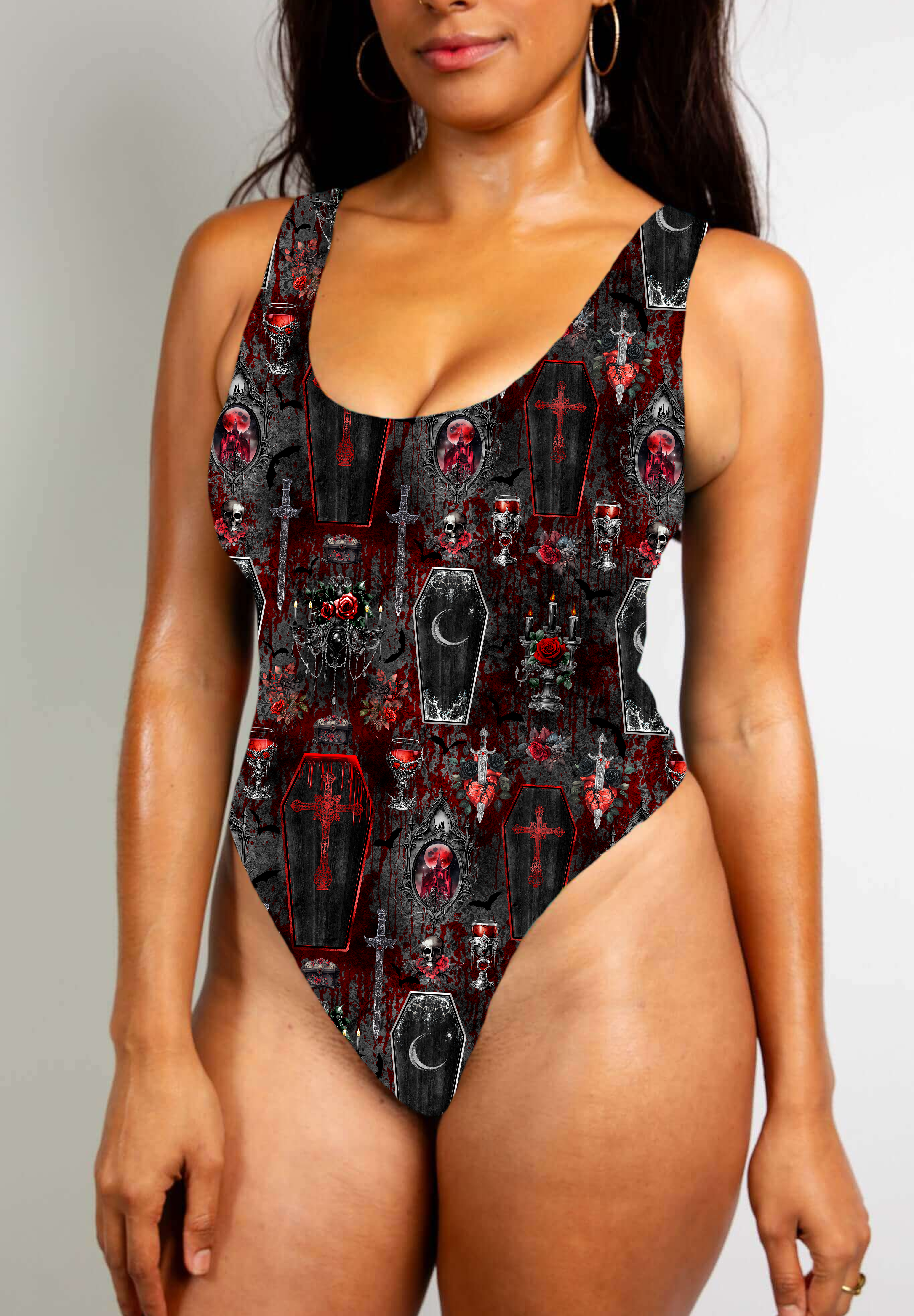 Red and black gothic bodysuit with coffin and skull motifs, featuring bold, dark, vampiric themes.