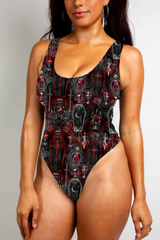 Red and black gothic bodysuit with coffin and skull motifs, featuring bold, dark, vampiric themes.