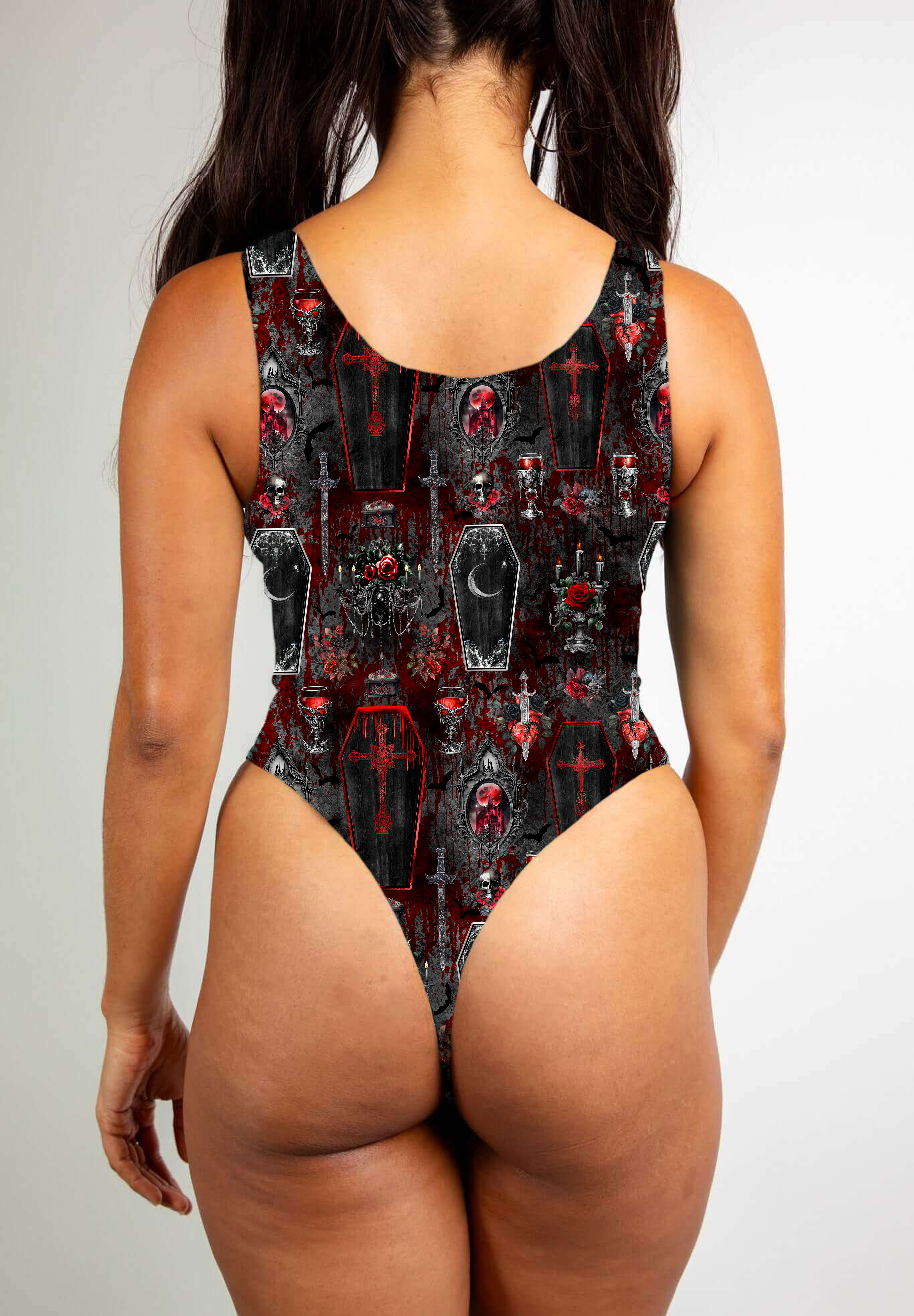 Red and black gothic bodysuit with coffin and skull motifs, featuring bold, dark, vampiric themes.