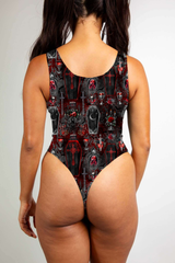 Red and black gothic bodysuit with coffin and skull motifs, featuring bold, dark, vampiric themes.