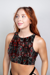 A dark gothic crop top adorned with red and black coffin and skull patterns, blending vampiric allure and modern style.