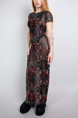 A full-length sheer mesh dress with a red and black coffin and cross pattern, offering a dark, vampiric elegance.