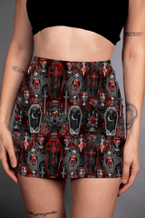 A mini skirt featuring a striking red and black coffin print, with gothic and vampire-inspired motifs throughout.
