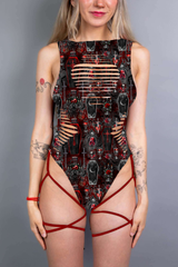  A gothic bodysuit with revealing slits and bold red straps, complemented by coffin and cross patterns in deep red and black.