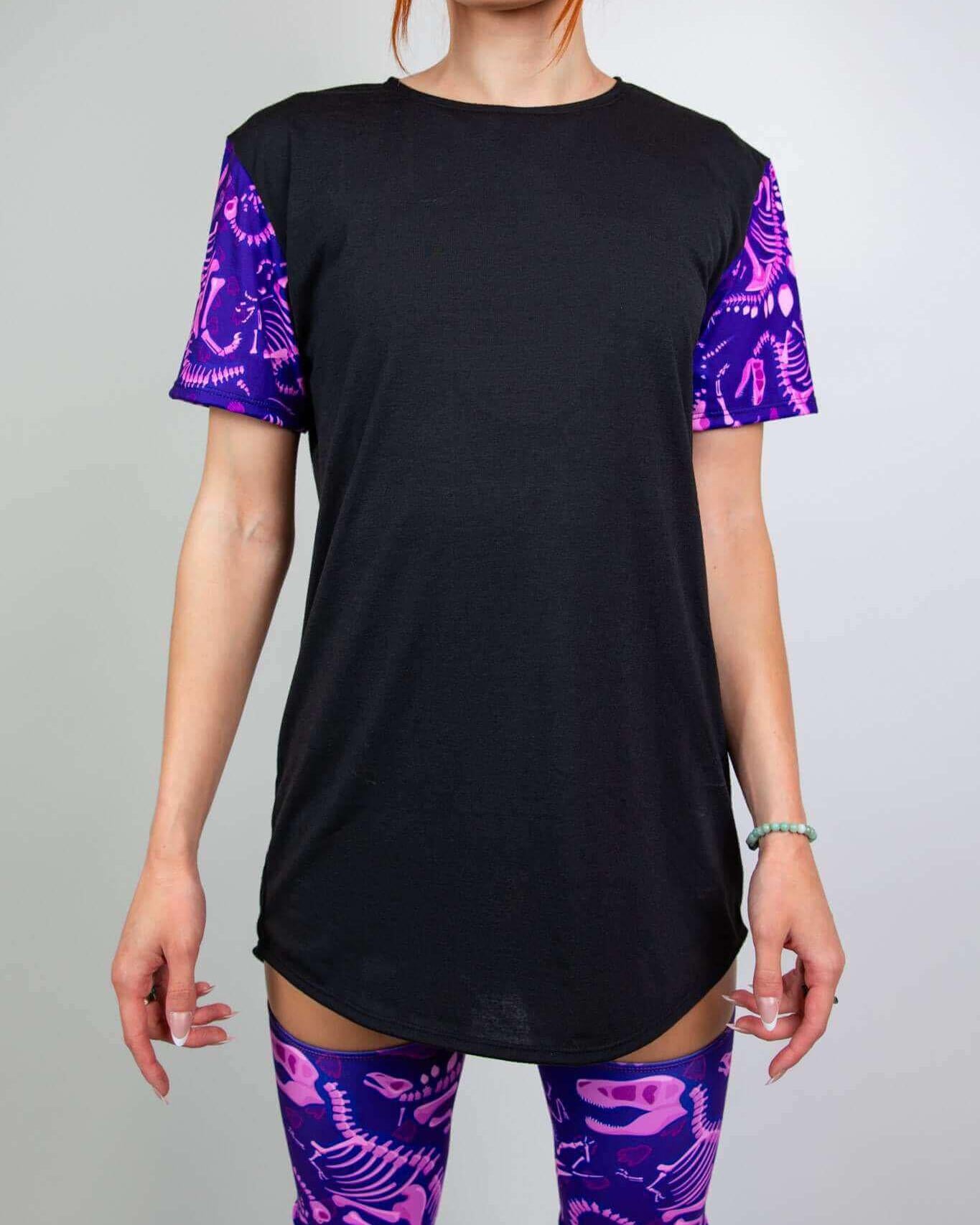 Black Baby Steps unisex t-shirt with purple dinosaur fossil sleeves, perfect for rave outfits. Soft and stretchy design.