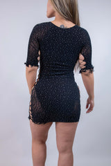 Back view of the Betty Rhinestone Dress in black, featuring side cutouts and a form-fitting design, perfect for rave outfits.