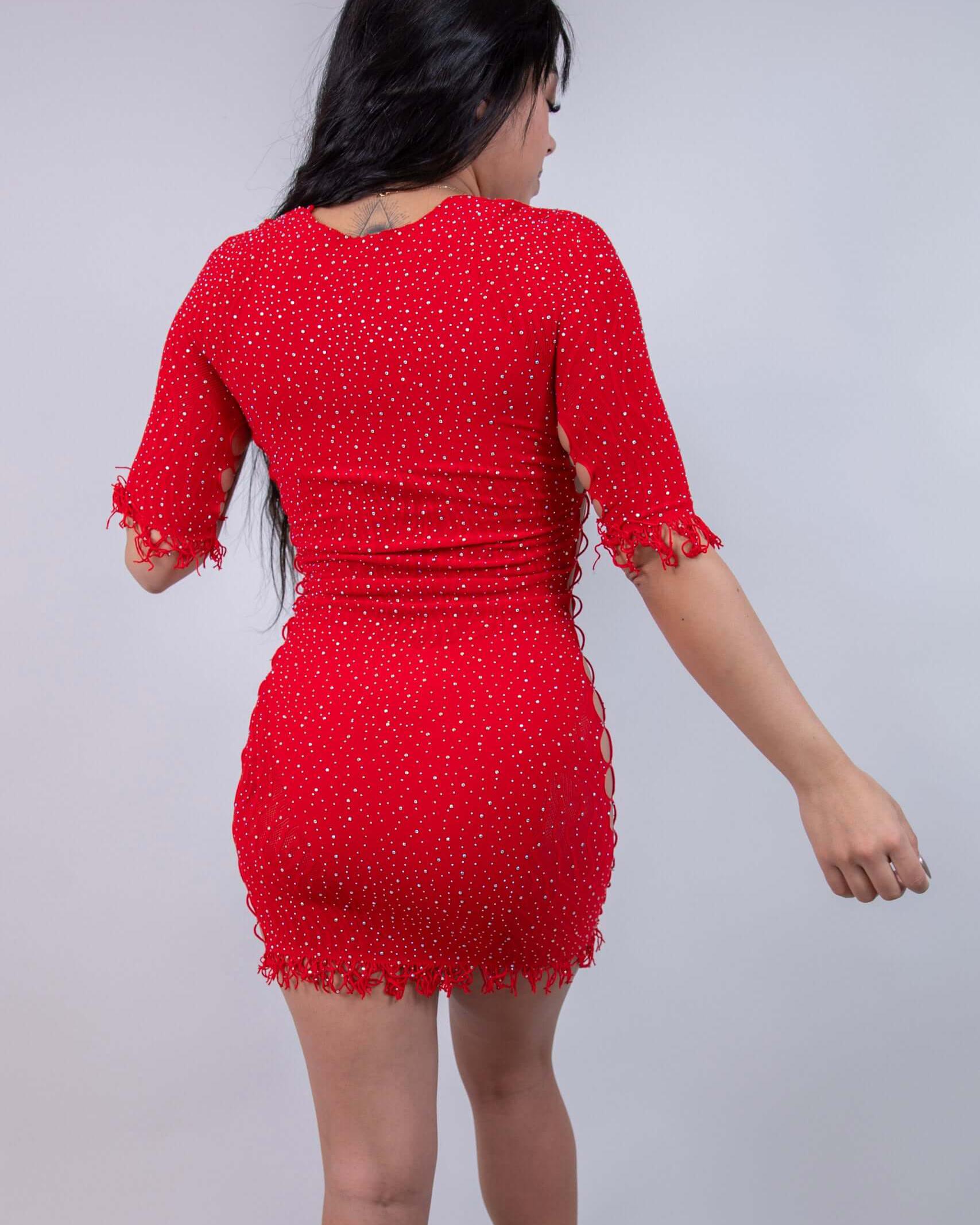 Model showcasing The Betty Rhinestone Dress in red, featuring cutouts and a figure-hugging bodycon design. Perfect for rave outfits.