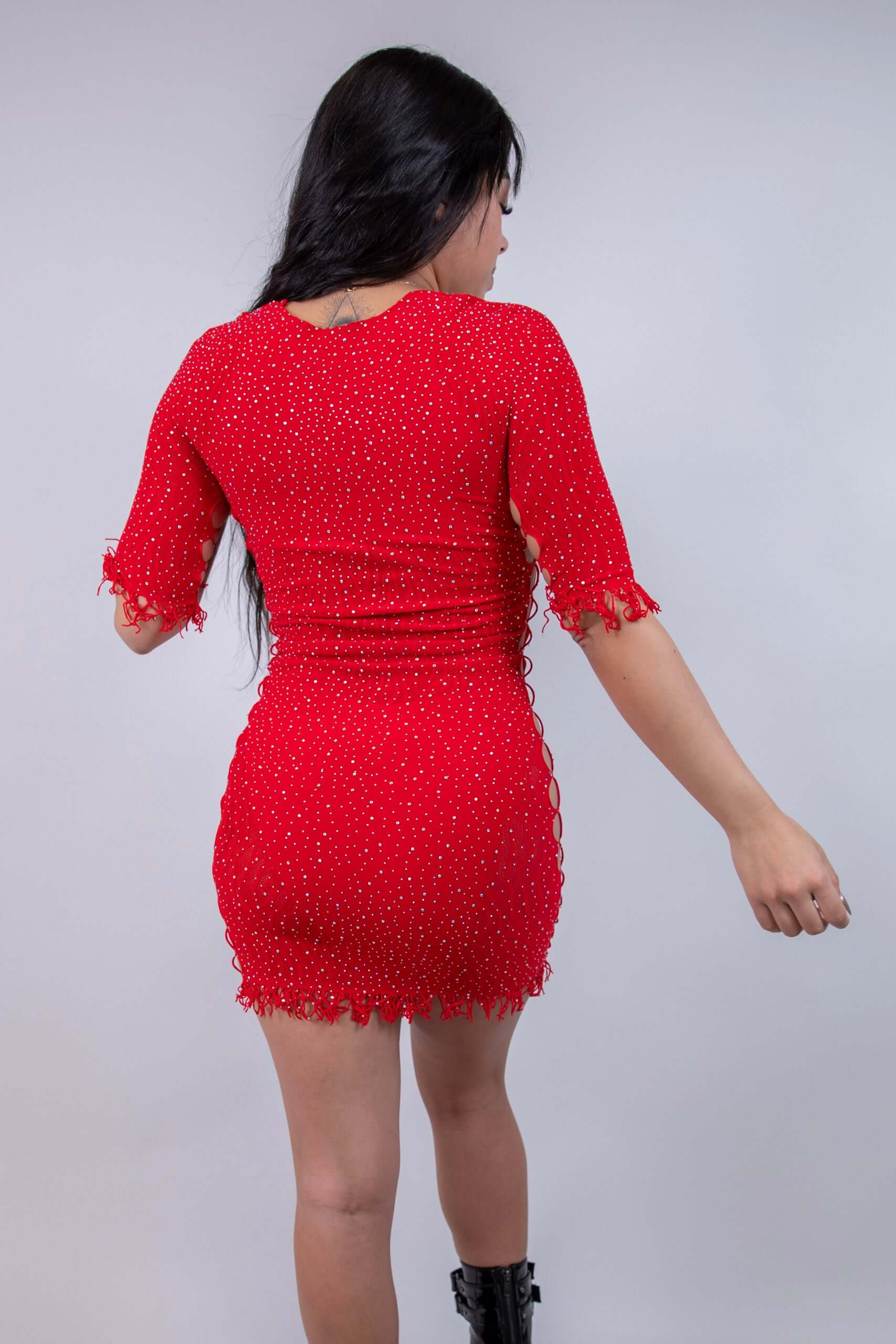 Model showcasing The Betty Rhinestone Dress in red, featuring cutouts and a figure-hugging bodycon design. Perfect for rave outfits.