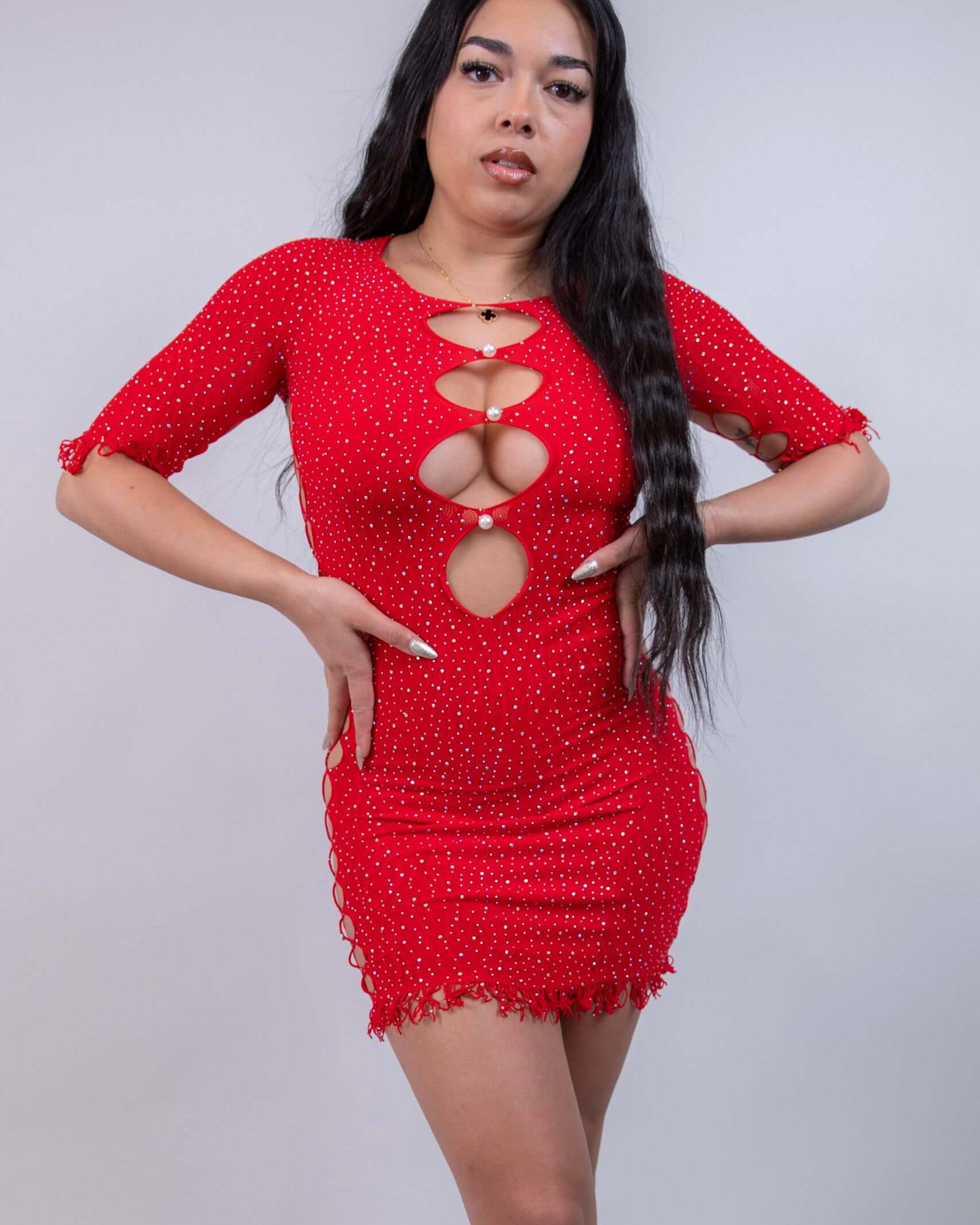 Model in a red rhinestone bodycon dress with side and front cutouts, perfect for rave outfits and party wear.