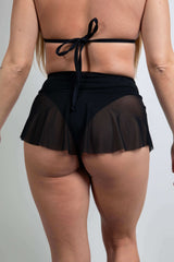 Black mesh micro skater skirt back view, highlighting lightweight design perfect for rave outfits.