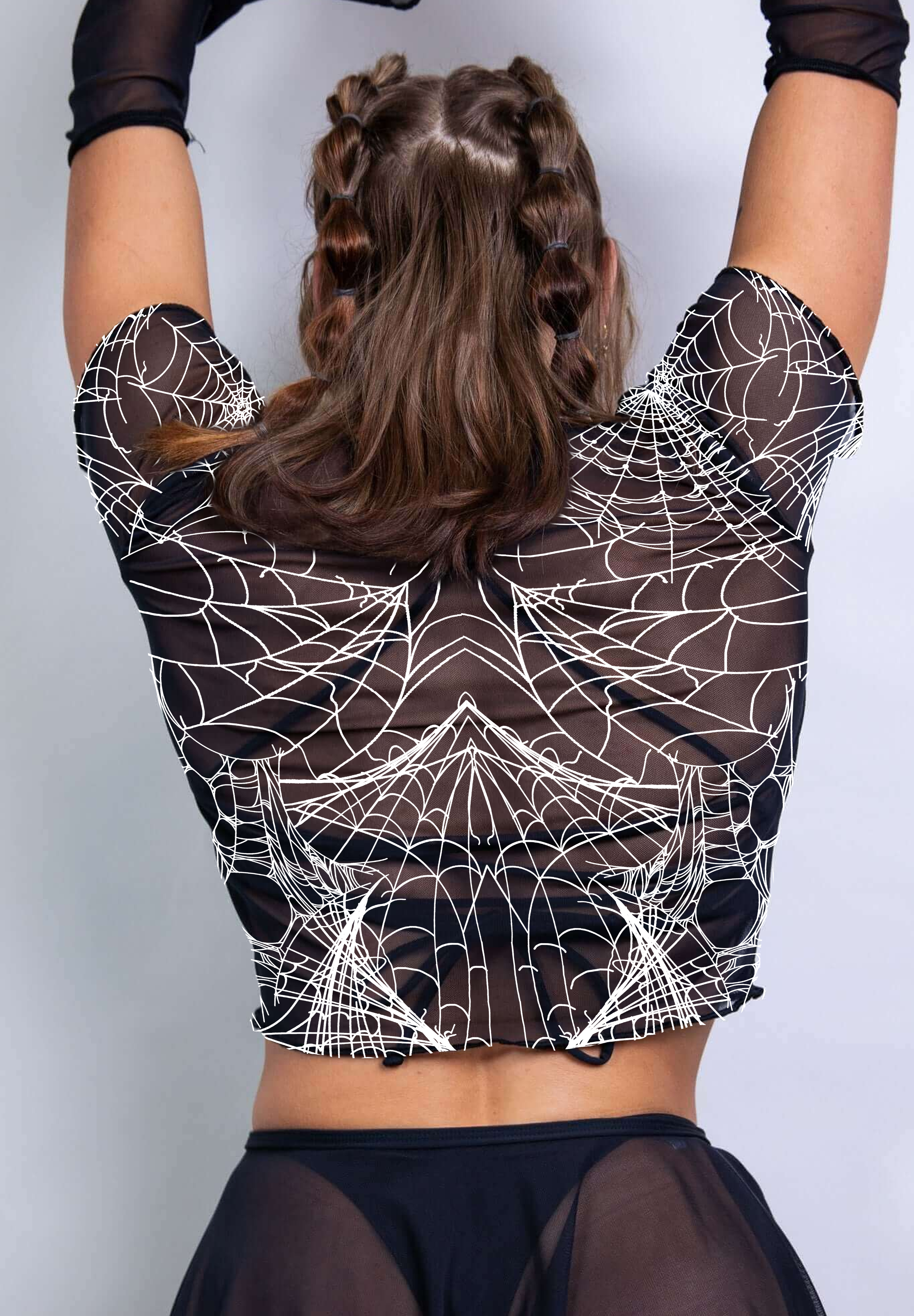 A sheer black baby tee featuring intricate white spider web patterns, offering a gothic, edgy look with a touch of dark elegance.