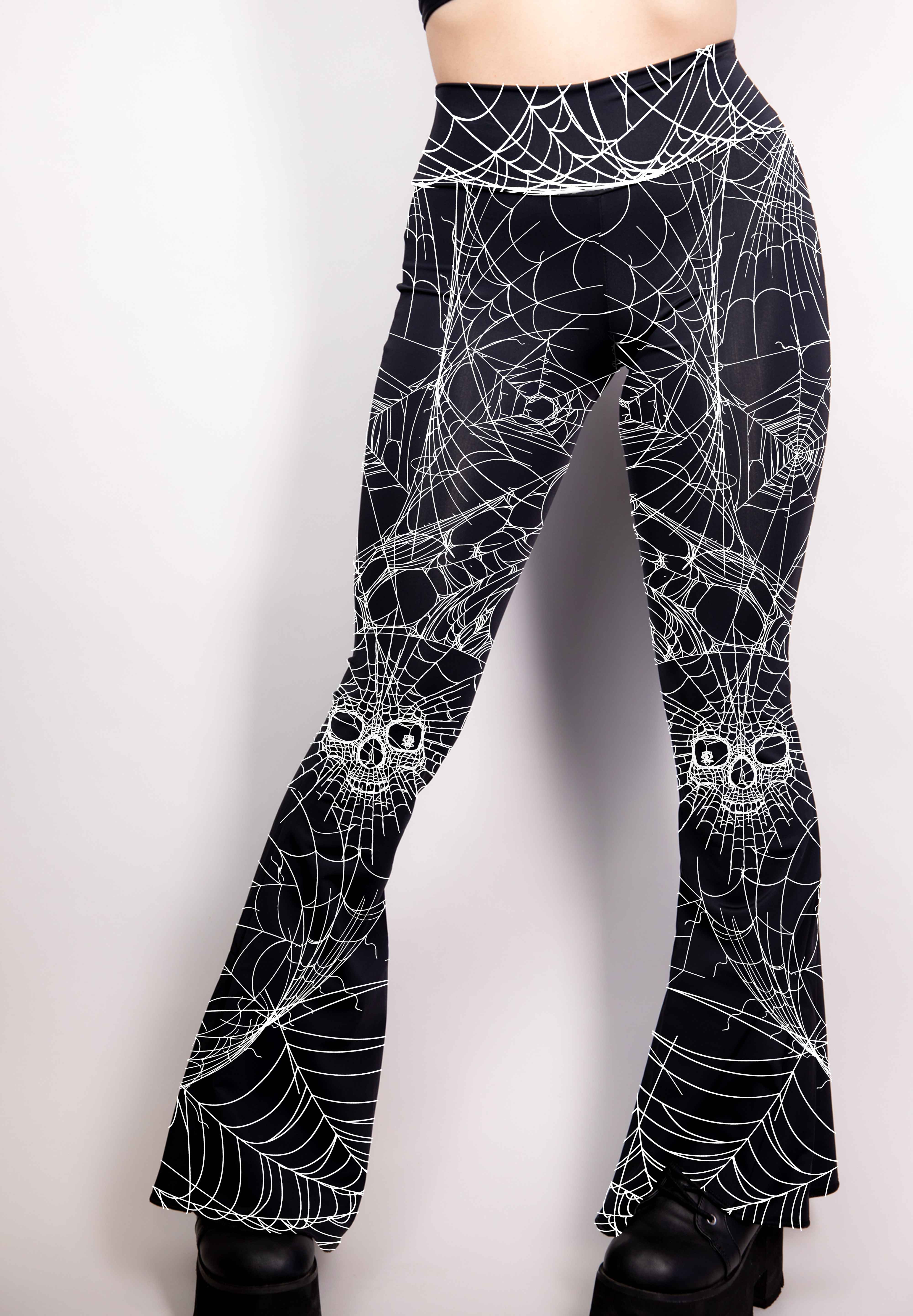 Black bell bottoms with a high-waist fit, adorned with subtle spider web detailing.