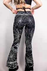 Black bell bottoms with a high-waist fit, adorned with subtle spider web detailing.