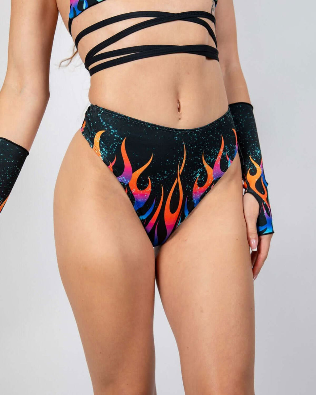 Model wearing Blaze High Waisted Thong with fiery gradient flame print, perfect for rave outfits.