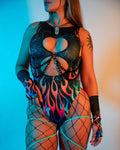 Model wearing the Blaze Keyhole Bodysuit featuring flame print and keyhole cutouts, perfect for rave outfits.