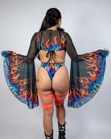 Model wears Blaze Mesh Bell Sleeves with flame print in a bold rave outfit, perfect for festivals and vibrant looks.