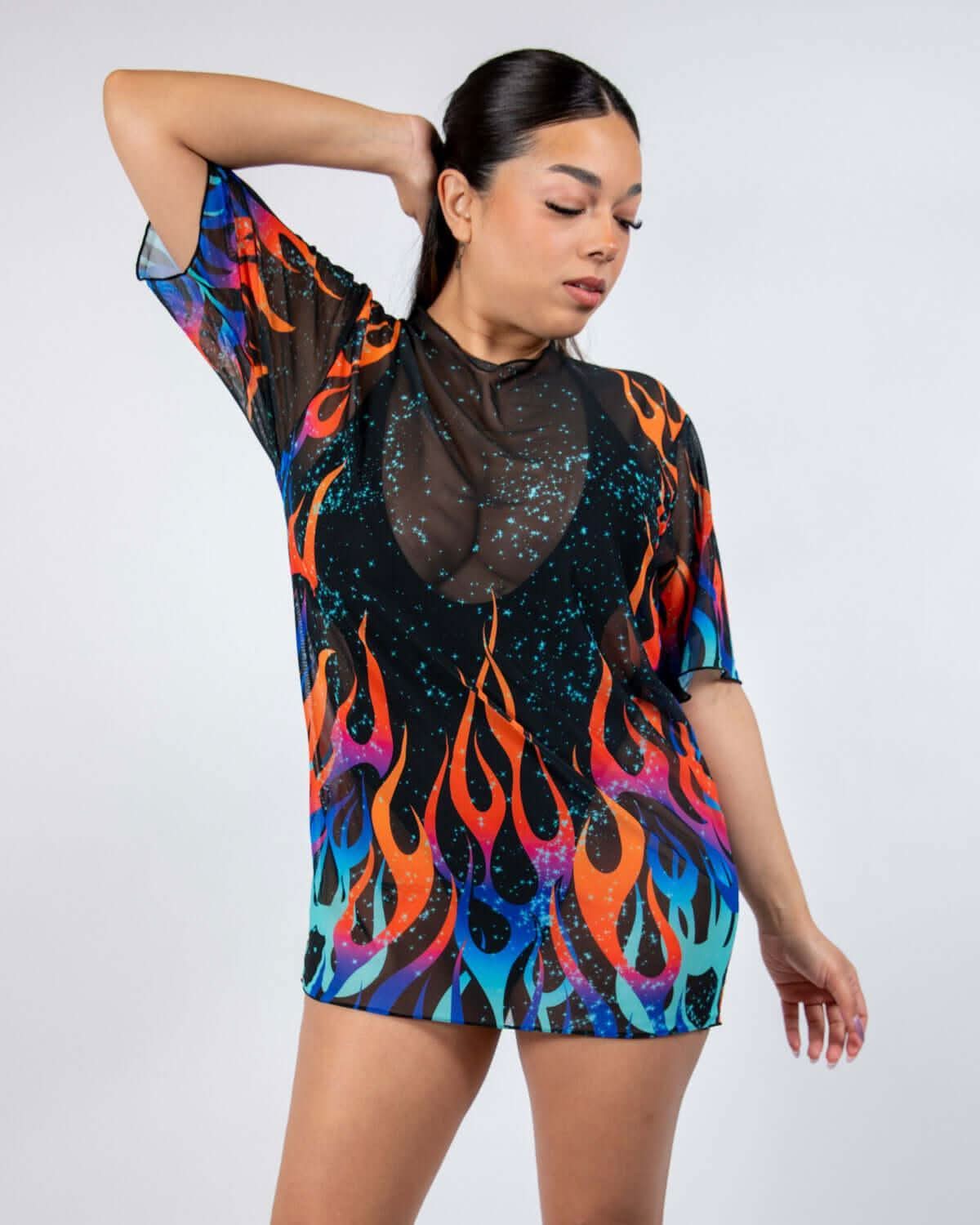 Model showcasing the Blaze Mesh Oversized Tee with vibrant flame print, perfect for rave outfits.