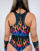 Back view of the Blaze V Free Top featuring a bold flame print and sheer mesh panels, perfect for rave outfits.