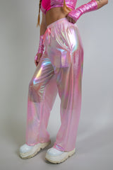 Bubble Gum Lucy Pants in iridescent pink, side view, high-waisted with wide-leg fit and reflective shine, perfect for rave fashion and festival wear.