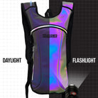 Hydration Pack Backpack (Small) in daylight and flashlight settings, showcasing its reflective surface and stylish design.