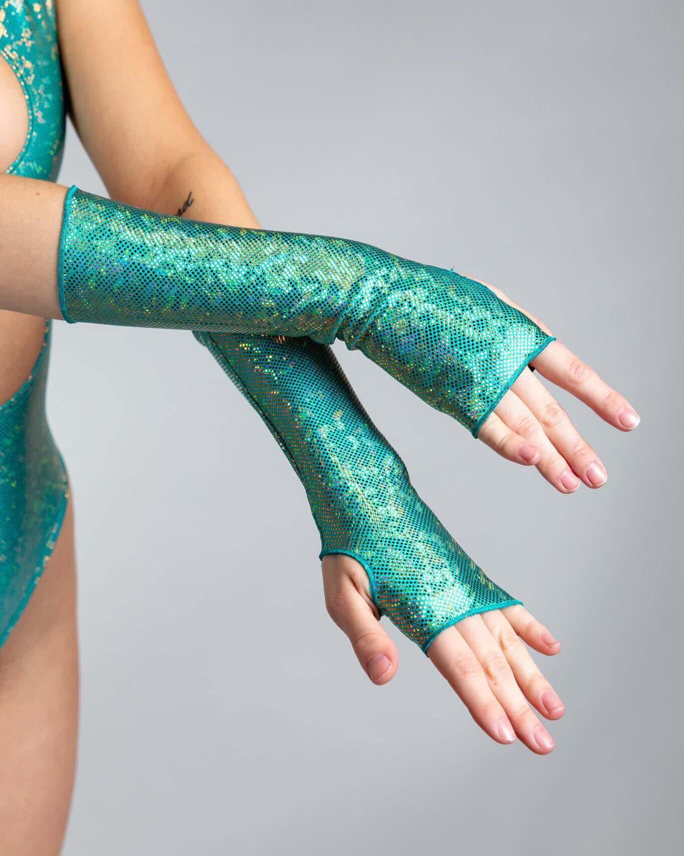 Calypso Holo Gloves in shimmering teal, designed for rave outfits, showcasing thumb holes and a comfy fit on forearms.