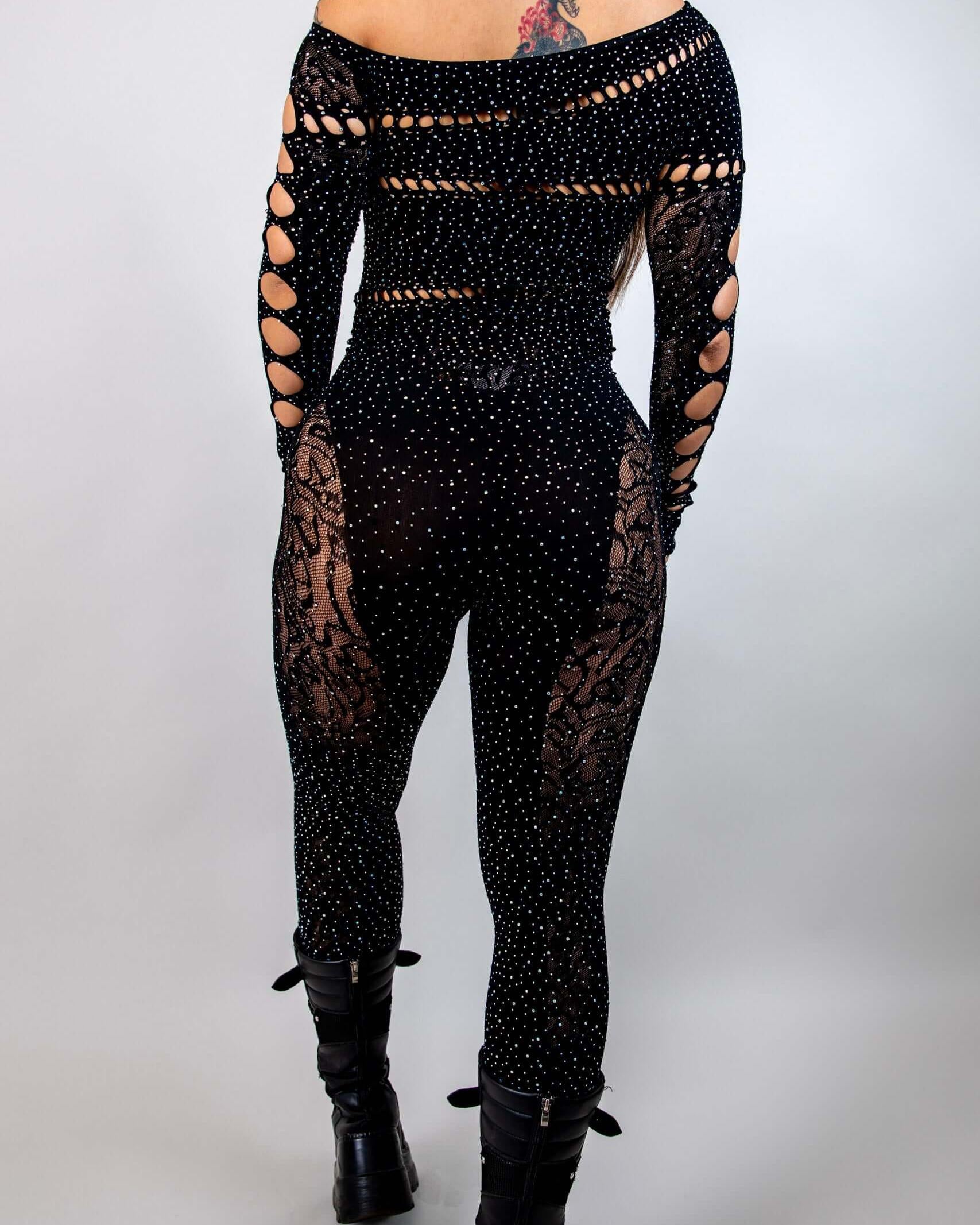 Off the shoulder black rhinestone jumpsuit with cutouts, ideal for bold rave outfits and stylish events.