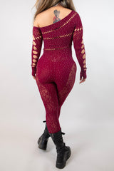 Back view of the burgundy Camilla Rhinestone Off the Shoulder Jumpsuit, showcasing its fishnet design and stylish cut-outs.