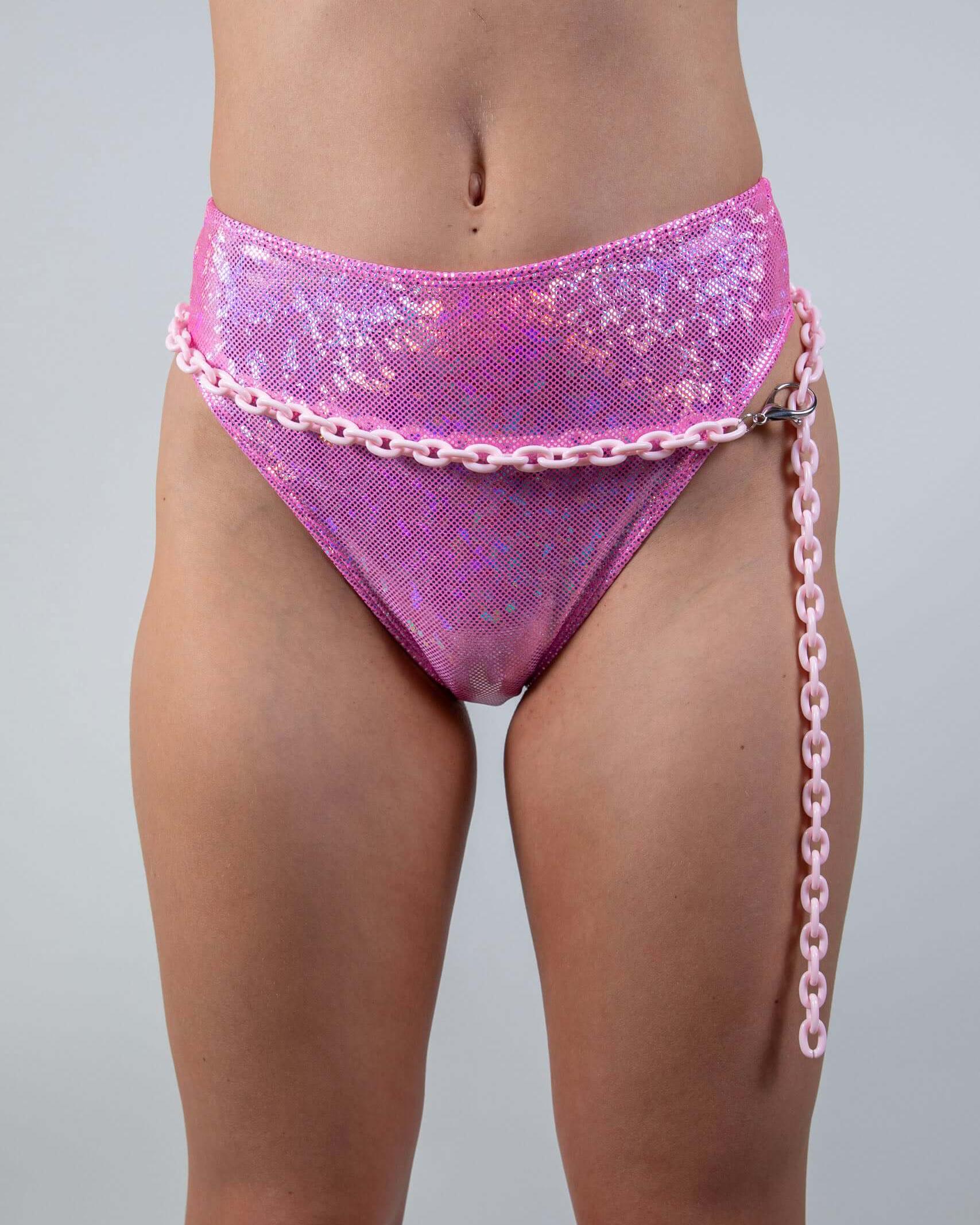 High-waisted pink bikini bottom styled with a light pink chain belt, perfect for rave outfits and summer fashion.