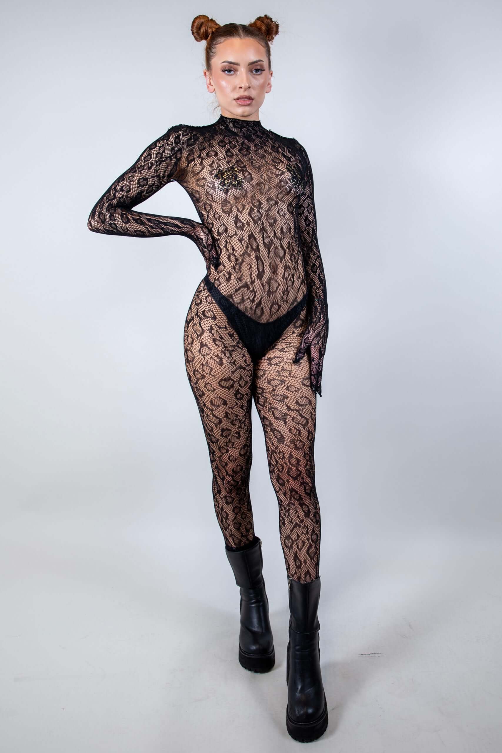 Model showcasing Cheetahlicious Full Body Fishnet Jumpsuit, a daring piece perfect for rave outfits.