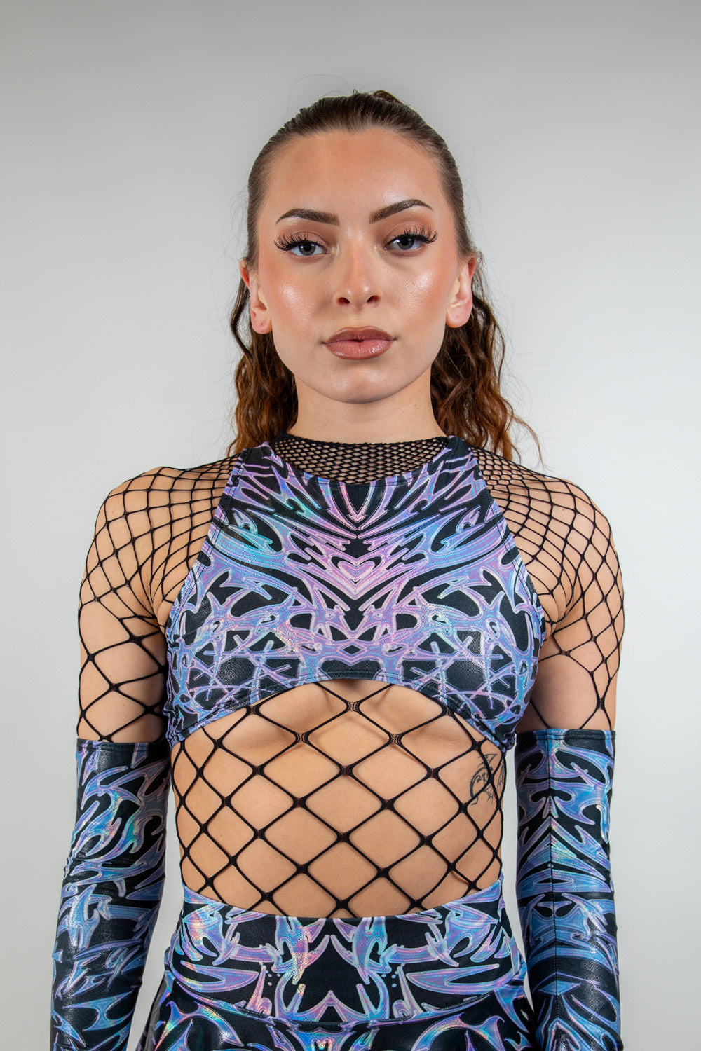 Front view of the Chromium Teaser Top, highlighting its high-neck cut and sheer cyber mesh panel.