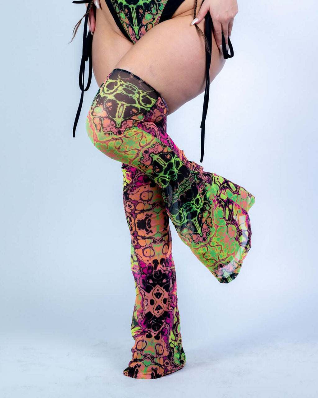 Intensity Cross Faded Bodysuit Set featuring vibrant UV-reactive prints and stylish leg sleeves for rave outfits.