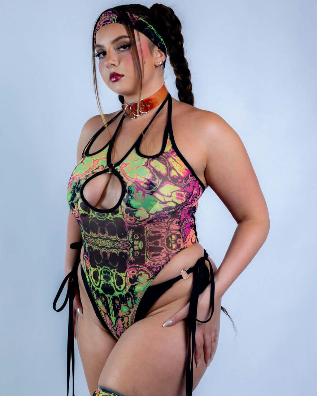 Intensity Cross Faded Bodysuit Set modeled with vibrant UV-reactive prints, perfect for rave outfits.