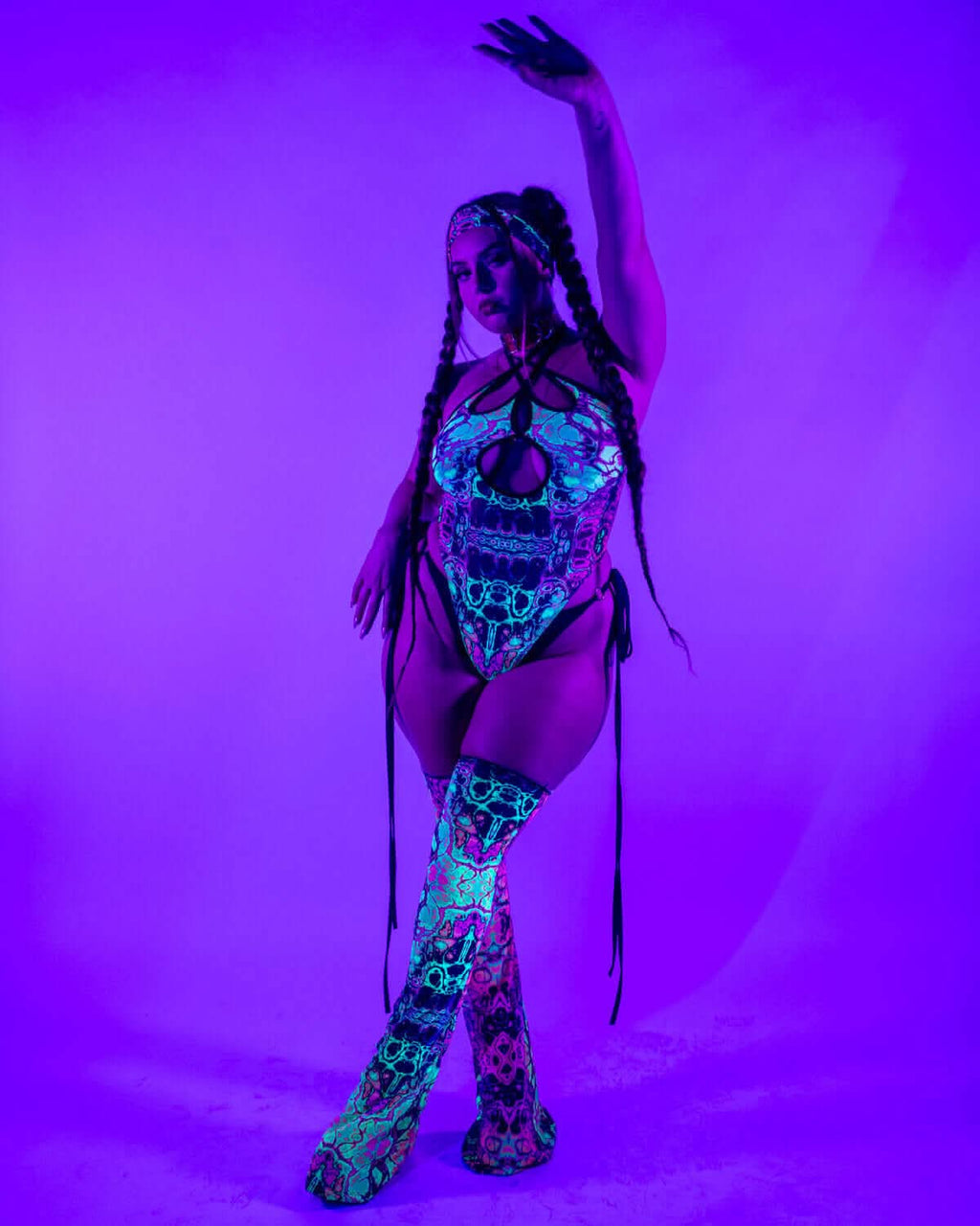 Intensity Cross Faded Bodysuit Set worn with vivid UV-reactive colors, perfect for rave outfits.